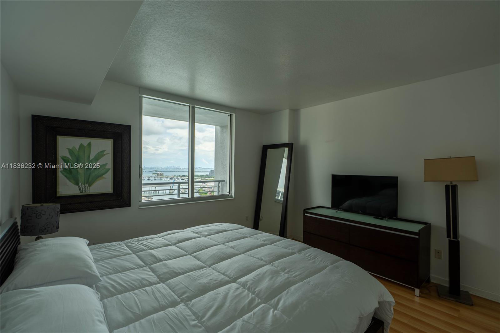 335 South Biscayne Boulevard, Unit 3410 Miami, FL 33131 - Photo 31 of 51 a bedroom with a bed and a television