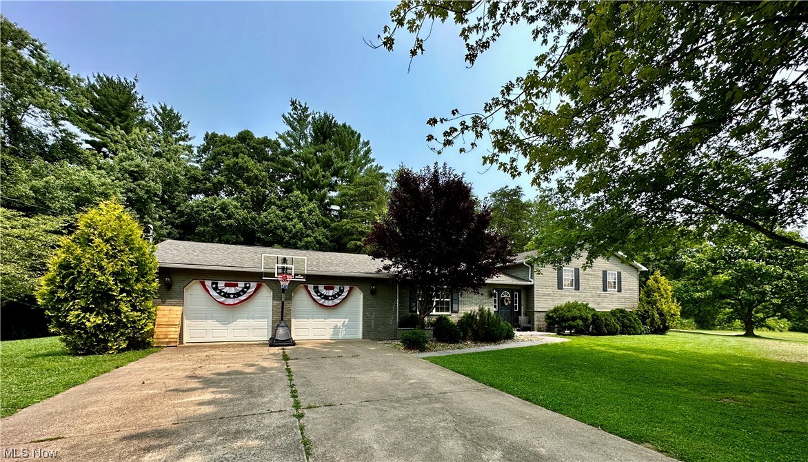 444 Eyermann Road Belpre, OH 45714 - Photo 1 of 16 Single story home featuring a garage and a front yard