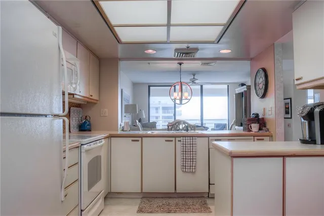 a kitchen with stainless steel appliances granite countertop a sink and cabinets