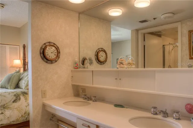a bathroom with a sink vanity and a mirror