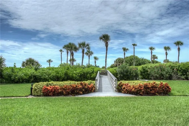 a front view of a building with a yard