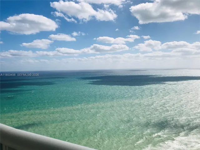 a view of yard and mountain in back