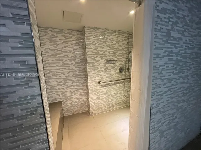 a view of a room with wooden walls