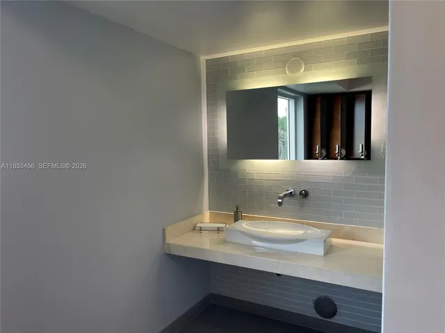 a building view with outdoor seating and garden