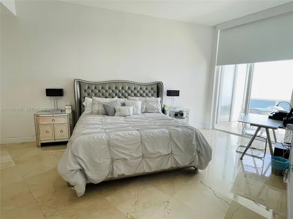 a bedroom with a bed and a cabinets