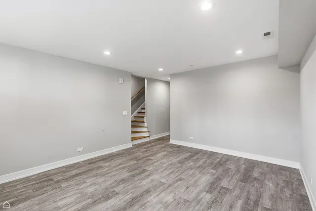 a bathroom with a granite countertop sink a toilet and shower