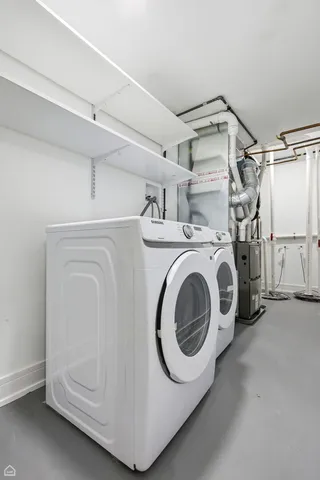 a view of kitchen with wooden floor and electronic appliances