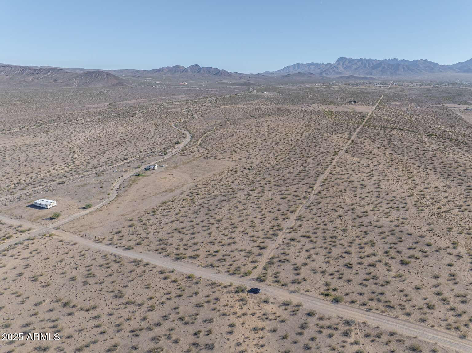 0 North Bullhead Road, Unit 57 Dolan Springs, AZ 86441 - Photo 6 of 36 a view of a dry field with mountains in the background