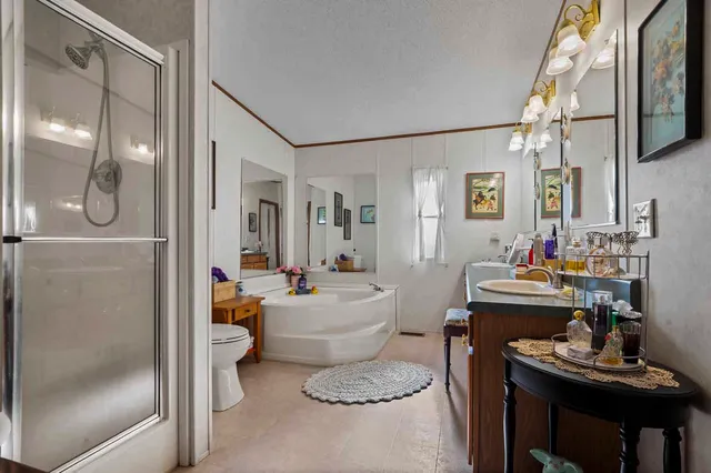 a view of a livingroom with furniture and windows