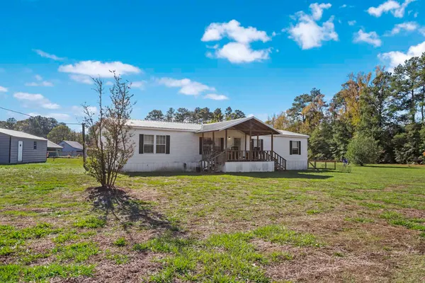 a view of a house with backyard porch and patio