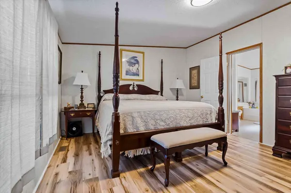 a bed room with a bed and a table