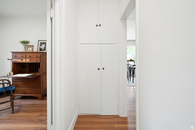 673 East 700 South Springville, UT 84663 - Photo 24 of 43 Hallway with wood-finish flooring and built-in storage cabinetry