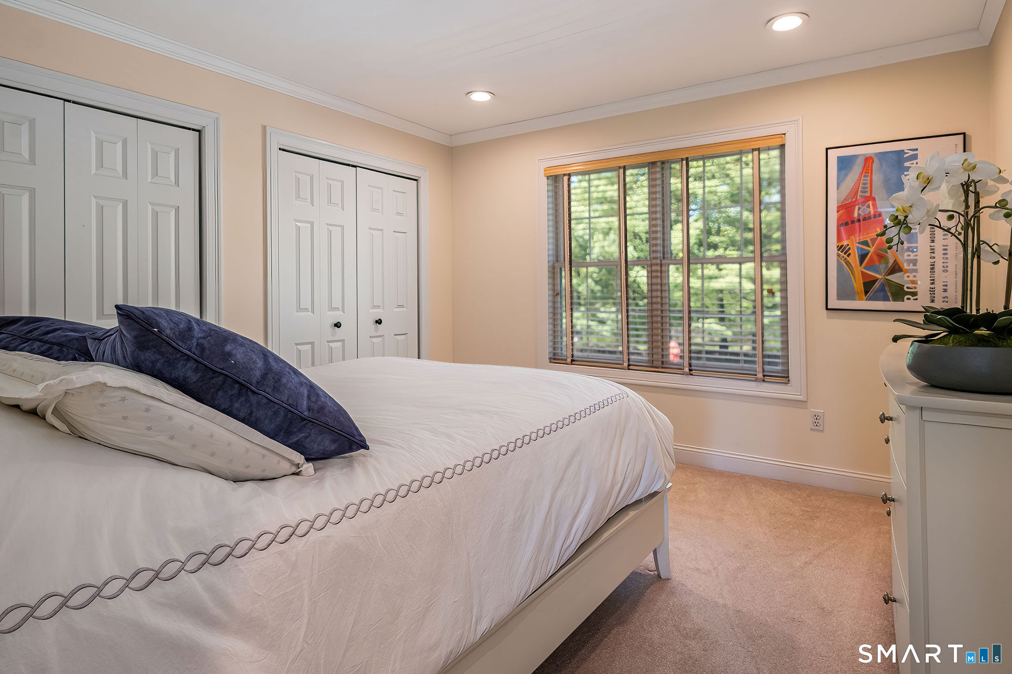 170 Devonshire Lane Madison, CT 06443 - Photo 24 of 39 a bedroom with a bed and a large window