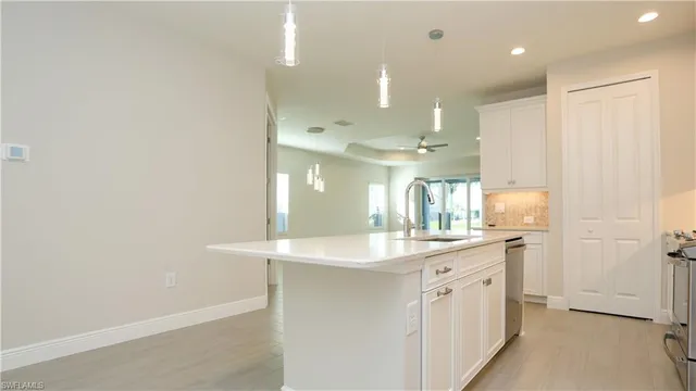 a bathroom with a double vanity sink and mirror