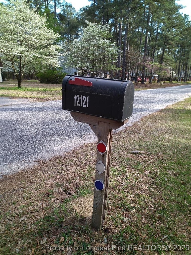 12121 Cameron Way Maxton, NC 28364 - Photo 11 of 29 a sign board with parking space