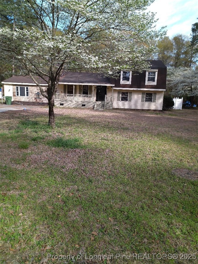 12121 Cameron Way Maxton, NC 28364 - Photo 12 of 29 a front view of a house with a yard