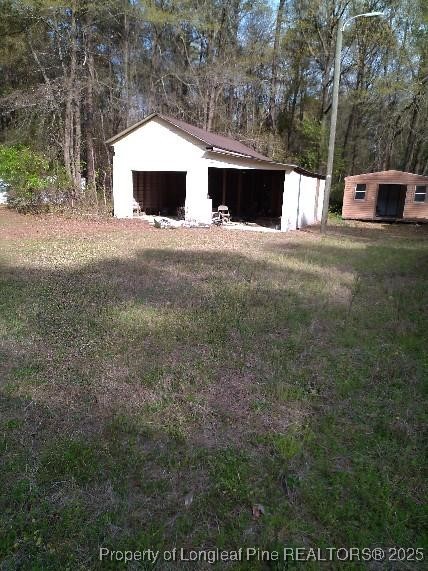 12121 Cameron Way Maxton, NC 28364 - Photo 17 of 29 a view of swimming pool with a yard