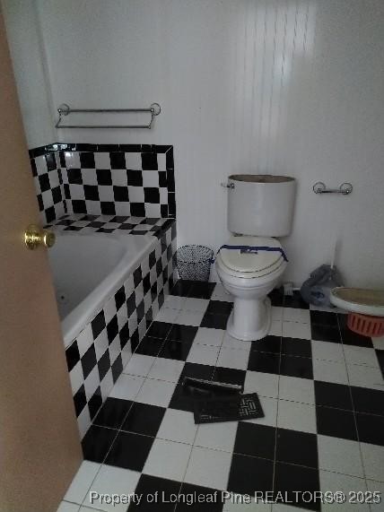 12121 Cameron Way Maxton, NC 28364 - Photo 20 of 29 a bathroom with a black and white checkered floor