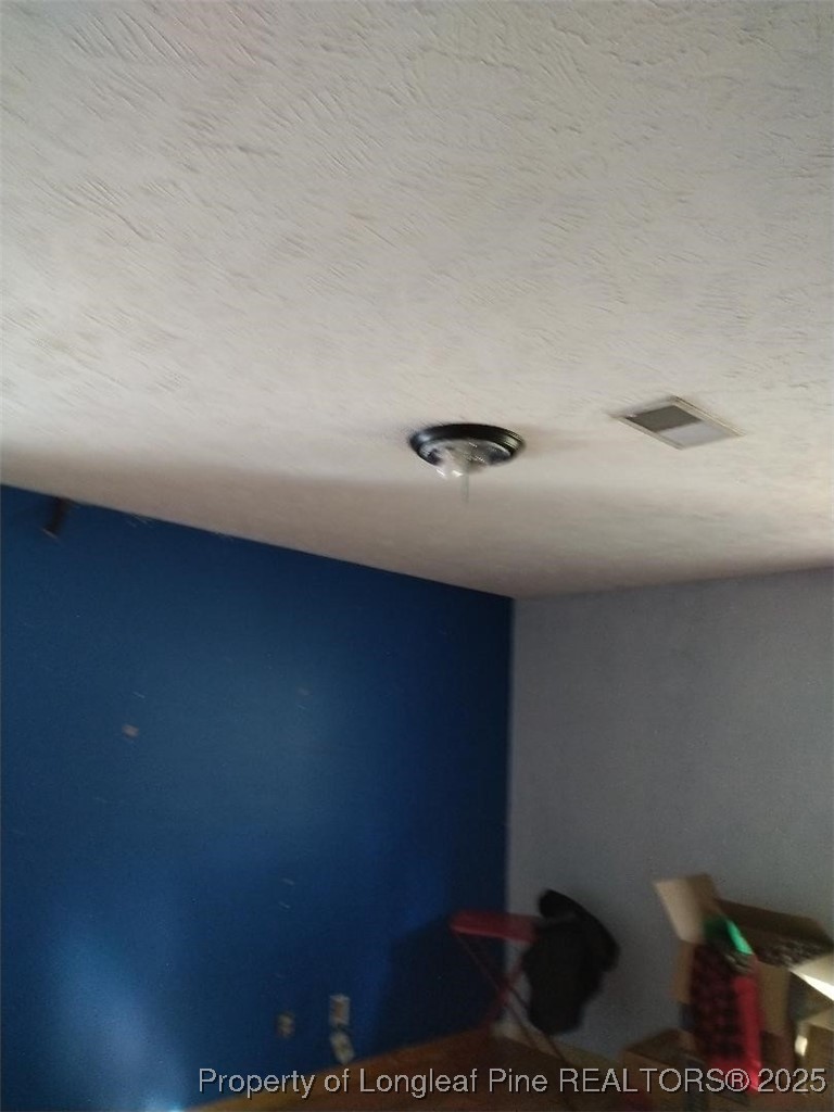 12121 Cameron Way Maxton, NC 28364 - Photo 5 of 29 a view of an empty room