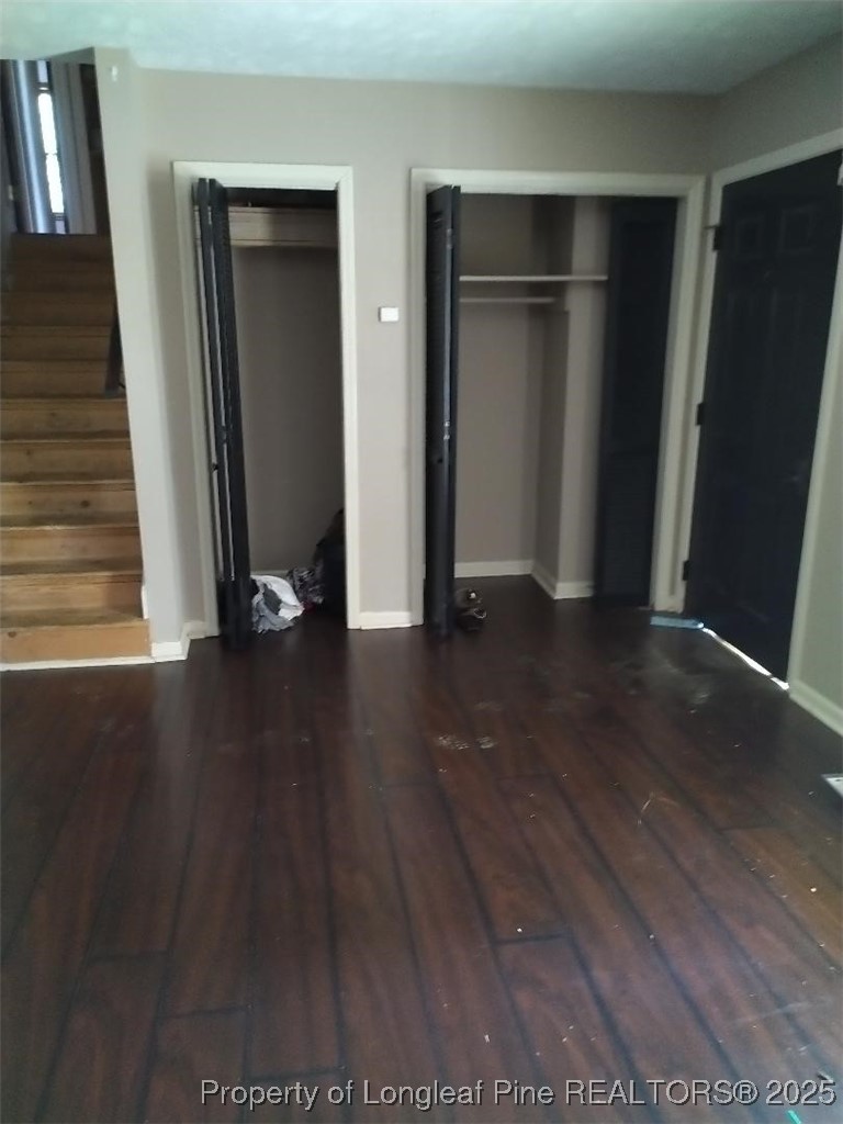 12121 Cameron Way Maxton, NC 28364 - Photo 7 of 29 an empty room with wooden floor and closet