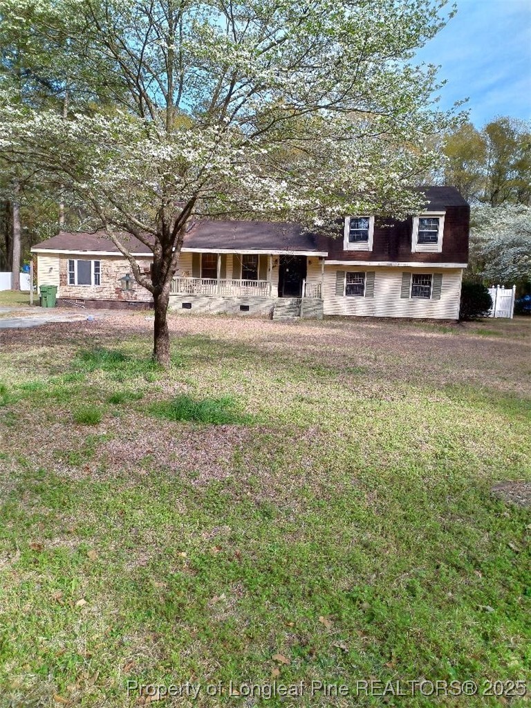 12121 Cameron Way Maxton, NC 28364 - Photo 10 of 29 a front view of a house with a yard