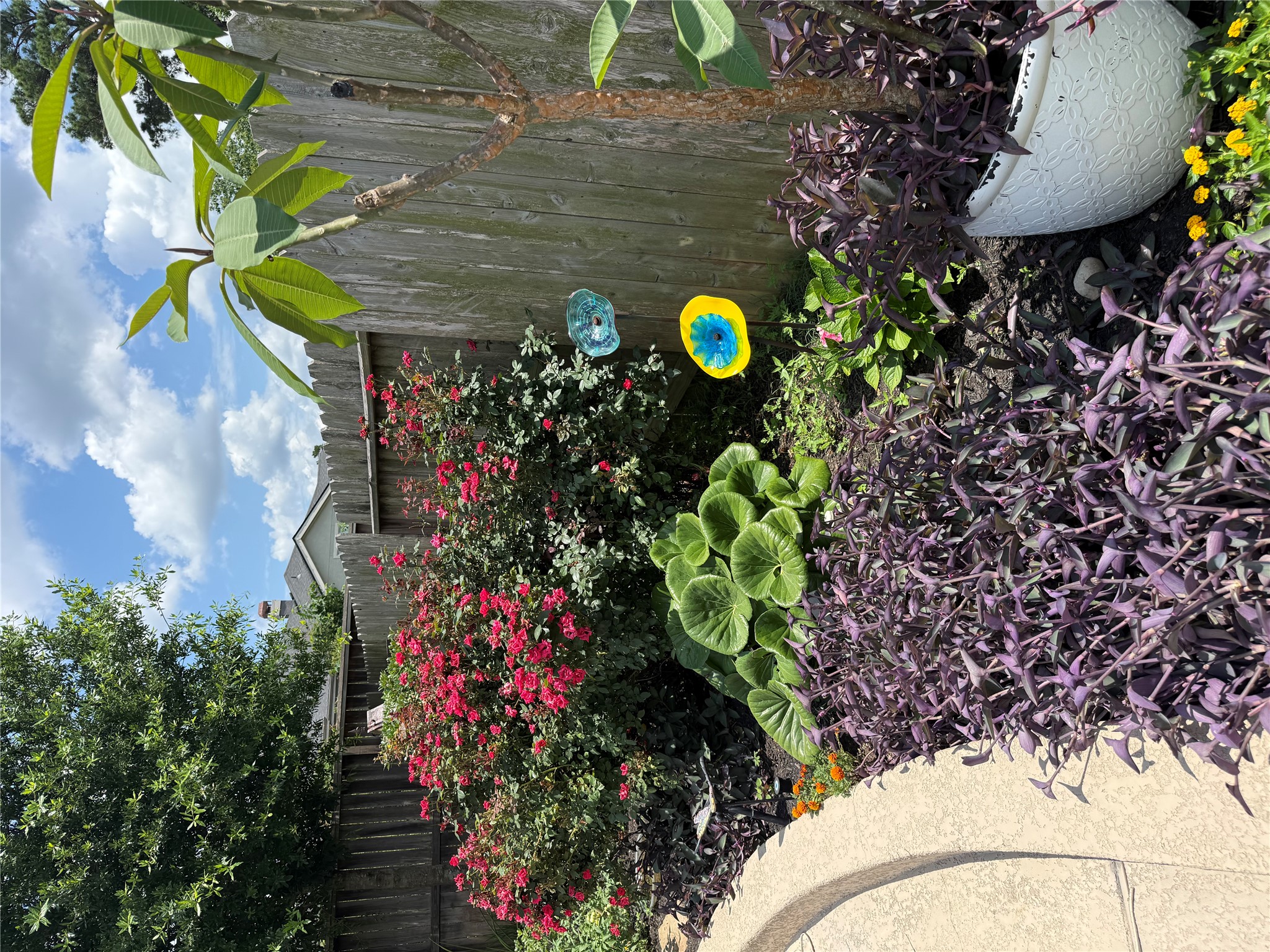 2336 Hagerman Road Conroe, TX 77384 - Photo 31 of 35 a view of a backyard with plants and flowers
