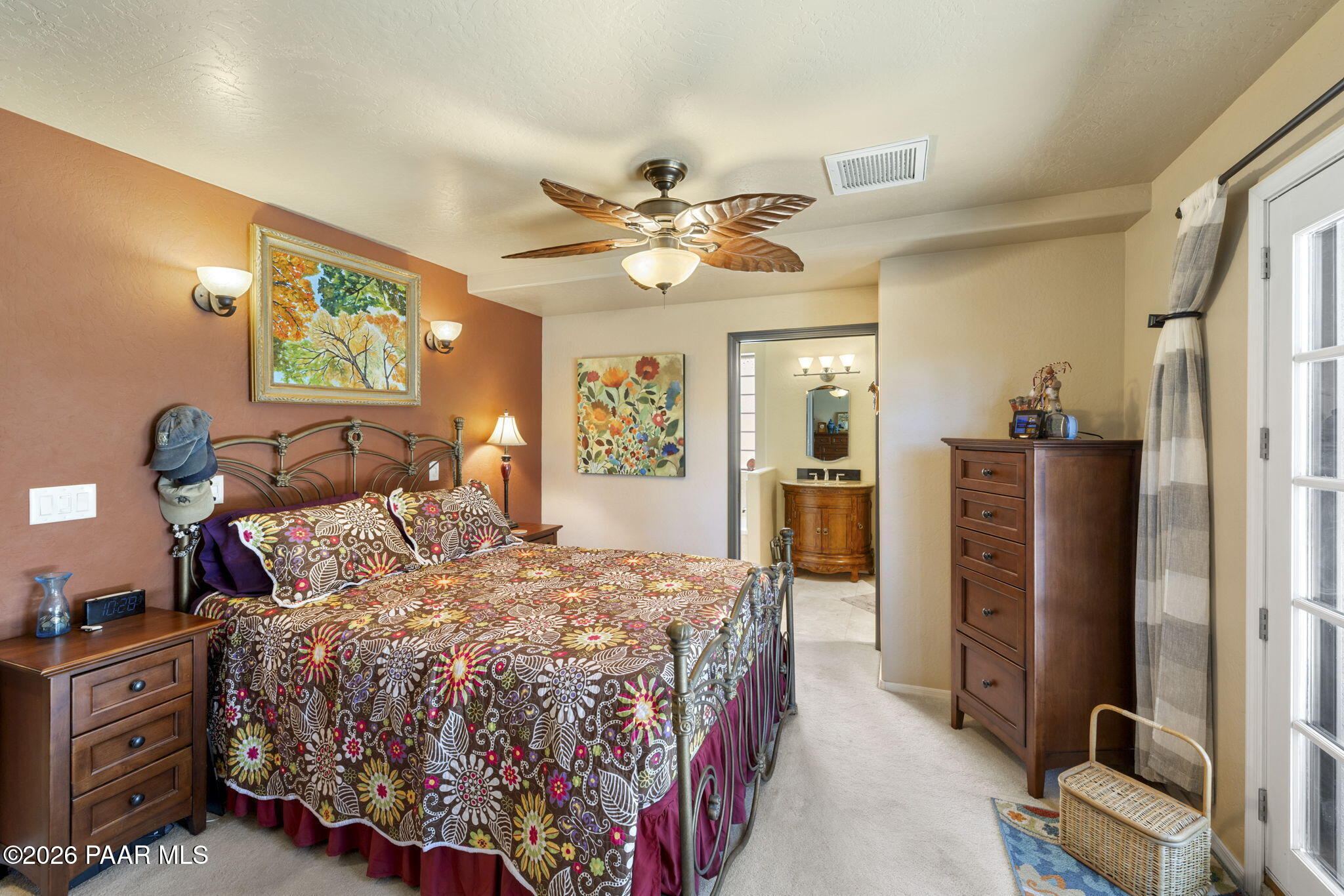 535 Copper Basin Road Prescott, AZ 86303 - Photo 20 of 41 a bedroom with a bed and a chandelier