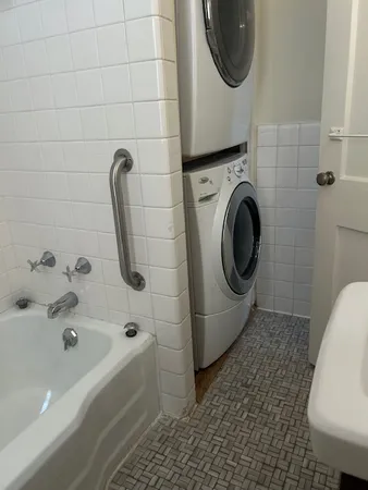 a bathroom with a sink a toilet and bathtub