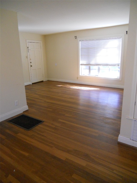 2511 Enfield Road, Unit B Austin, TX 78703 - Photo 6 of 12 an empty room with wooden floor and windows