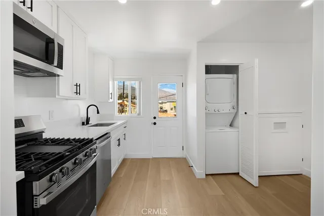 a kitchen with a stove and a microwave