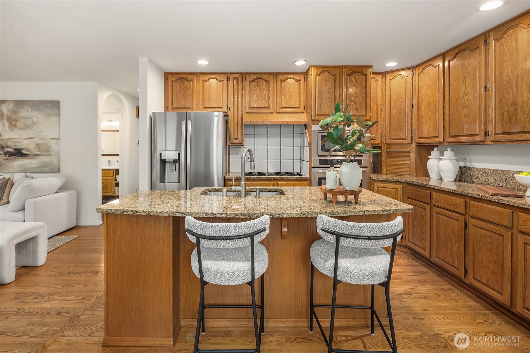 1417 232nd Place Southwest Bothell, WA 98021 - Photo 13 of 40 a kitchen with a table chairs sink and cabinets