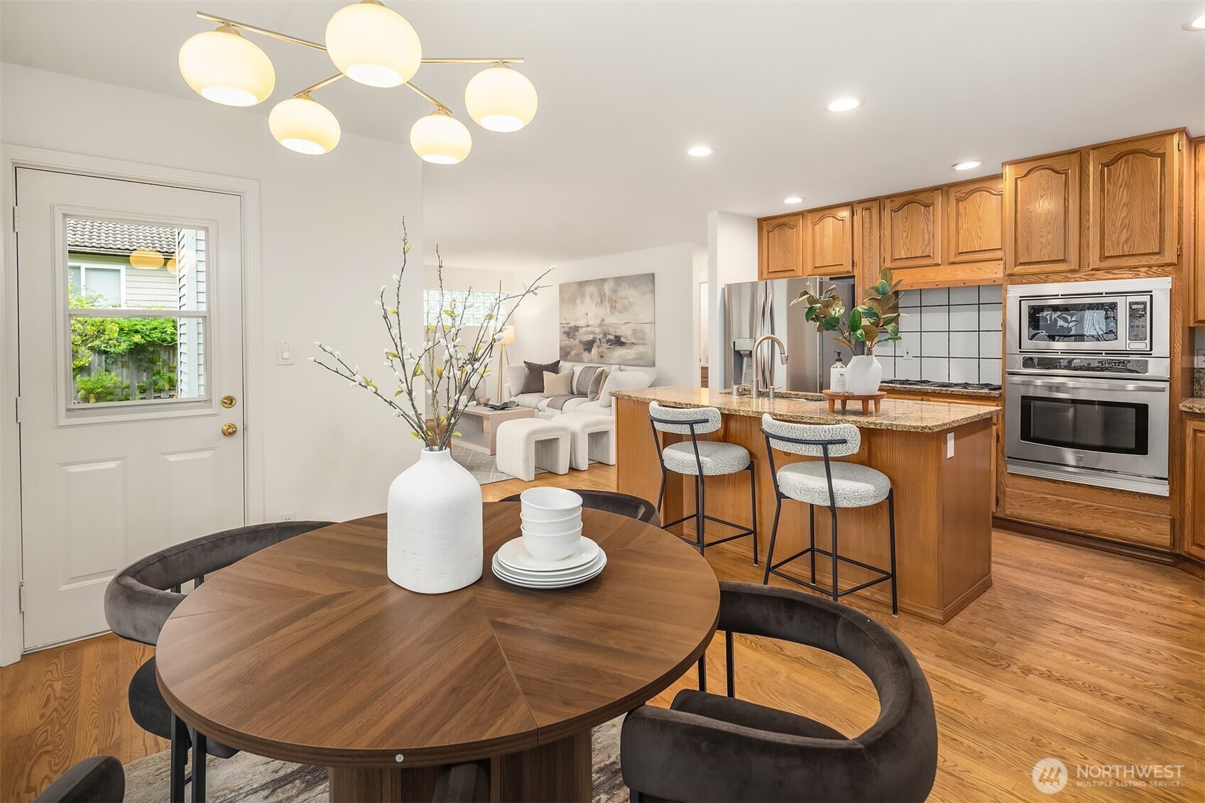 1417 232nd Place Southwest Bothell, WA 98021 - Photo 17 of 40 a view of a dining room with furniture and wooden floor