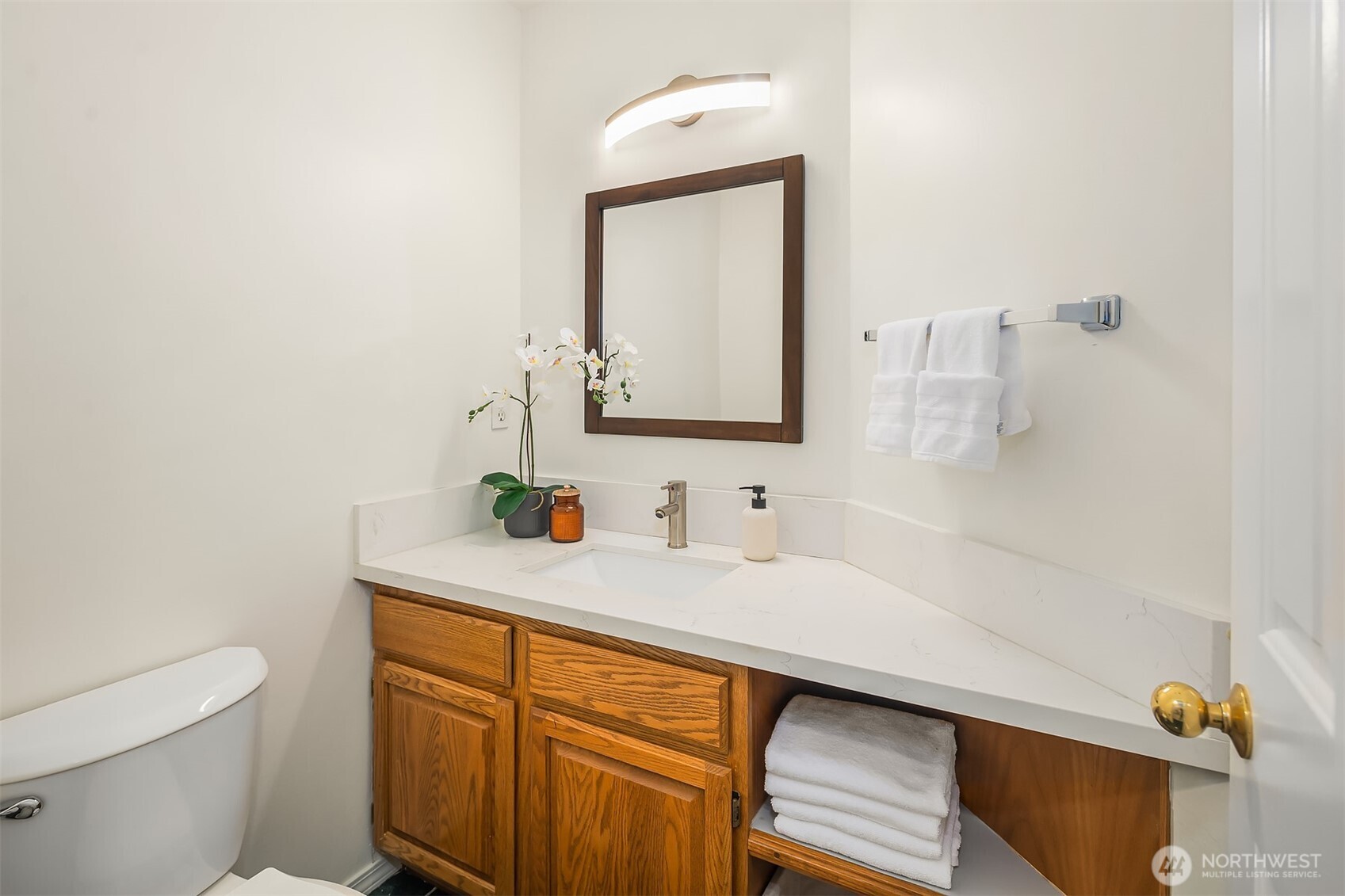 1417 232nd Place Southwest Bothell, WA 98021 - Photo 19 of 40 a bathroom with a sink a toilet and mirror