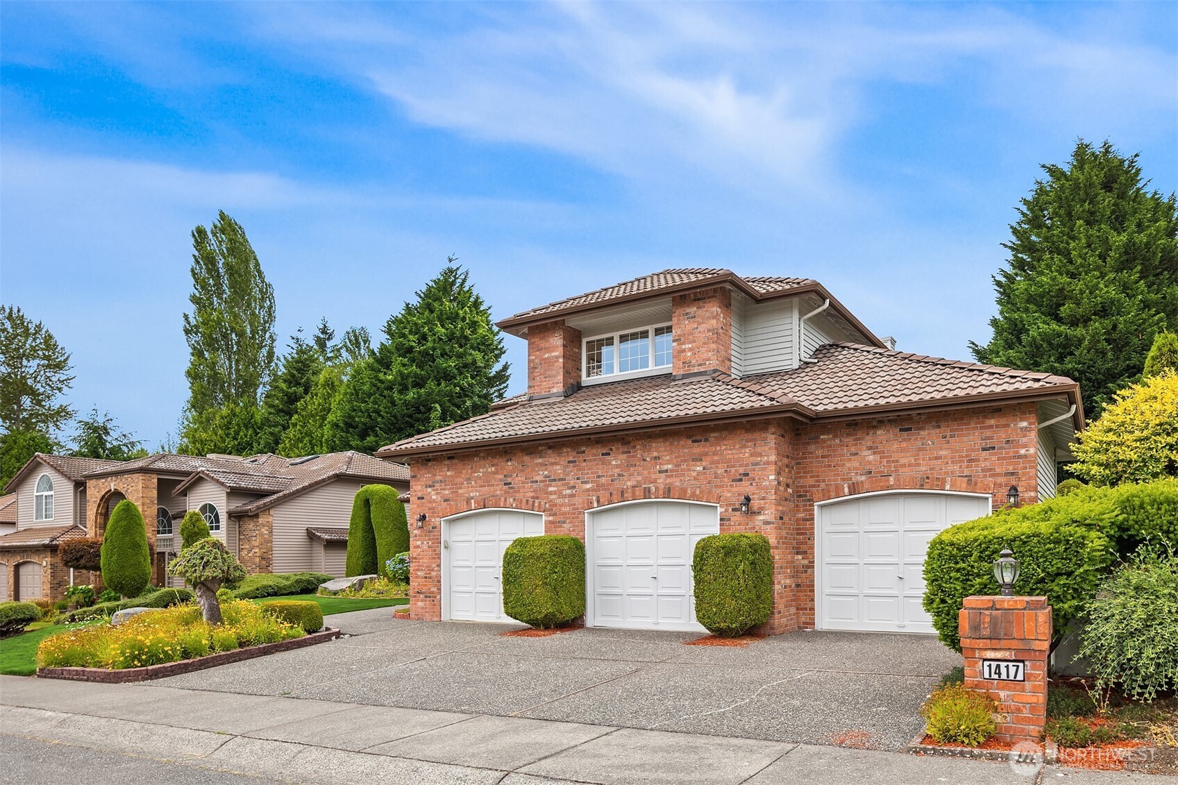 1417 232nd Place Southwest Bothell, WA 98021 - Photo 2 of 40 a front view of a house with garden