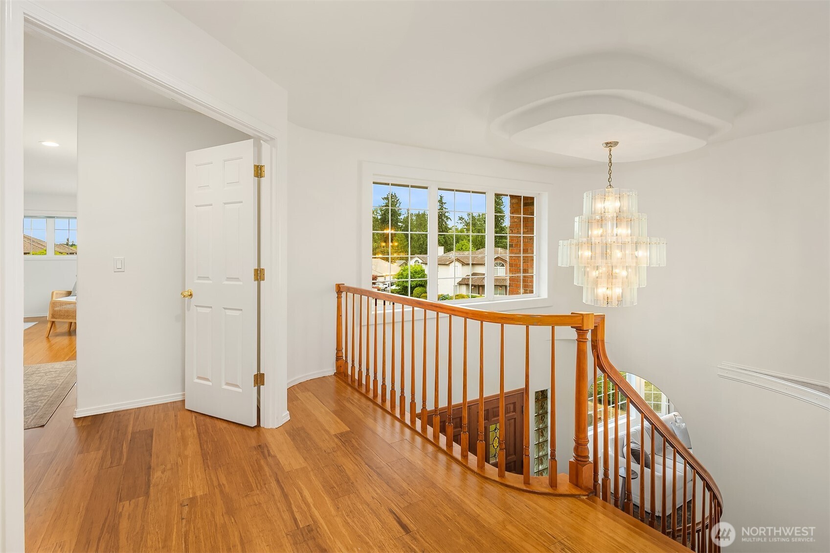 1417 232nd Place Southwest Bothell, WA 98021 - Photo 21 of 40 a view of hallway with wooden floor and windows