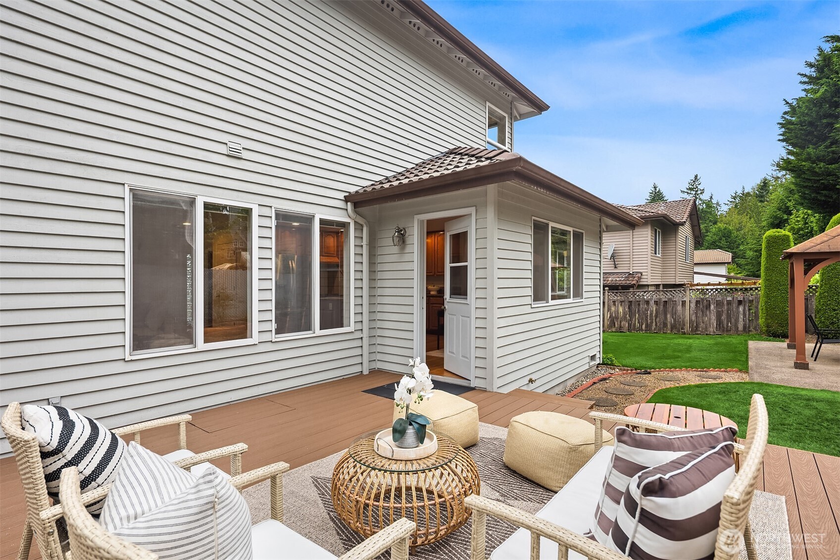 1417 232nd Place Southwest Bothell, WA 98021 - Photo 31 of 40 a view of a patio with couches chairs and a fire pit