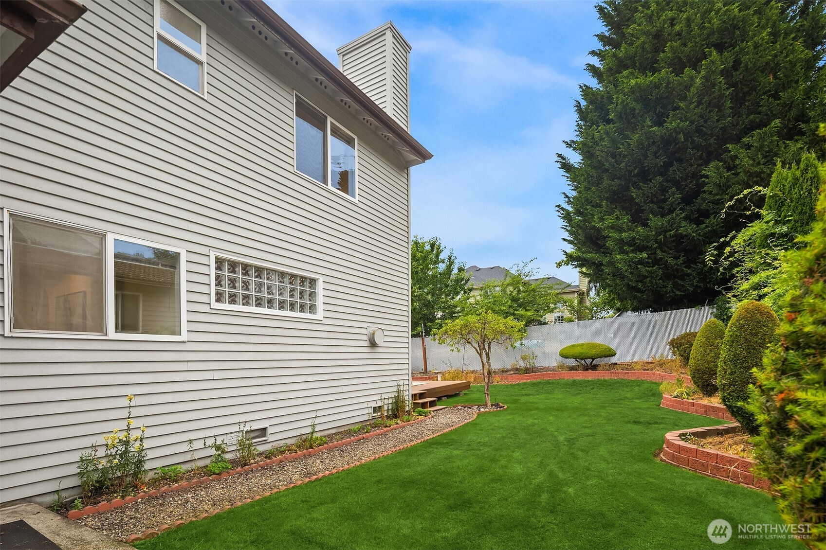 1417 232nd Place Southwest Bothell, WA 98021 - Photo 33 of 40 a view of backyard with a garden
