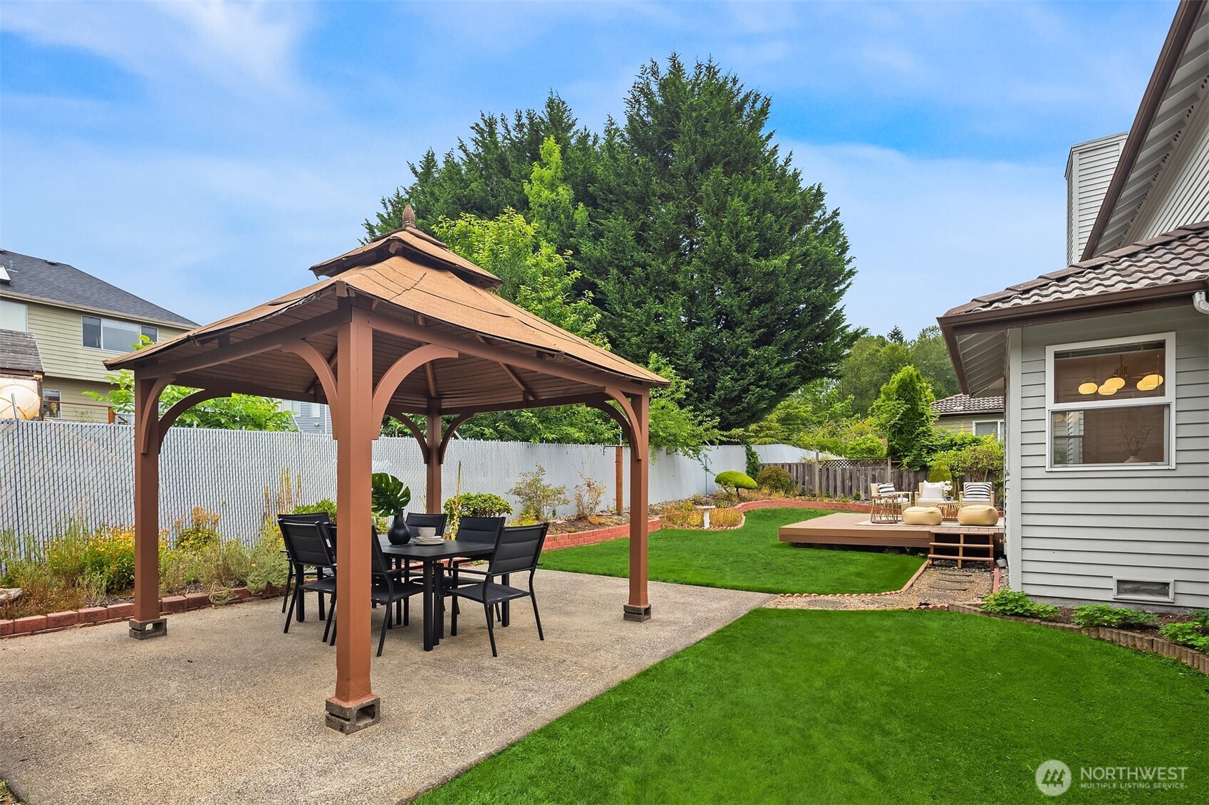 1417 232nd Place Southwest Bothell, WA 98021 - Photo 34 of 40 a view of a two chairs in a yard