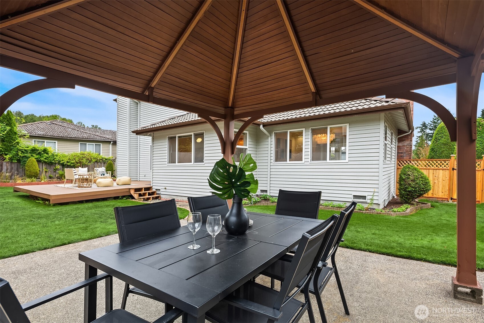 1417 232nd Place Southwest Bothell, WA 98021 - Photo 35 of 40 a view of a patio with table and chairs and potted plants