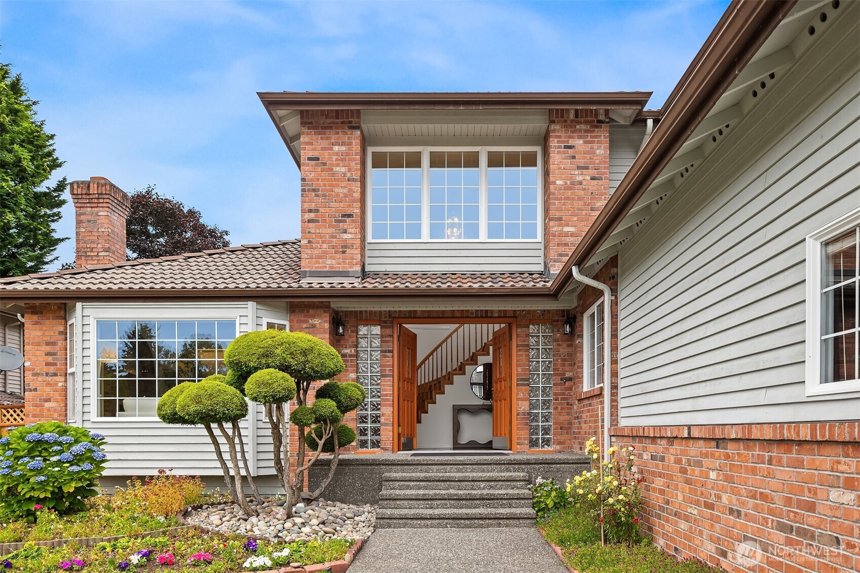 1417 232nd Place Southwest Bothell, WA 98021 - Photo 4 of 40 a view of a house with a porch and furniture