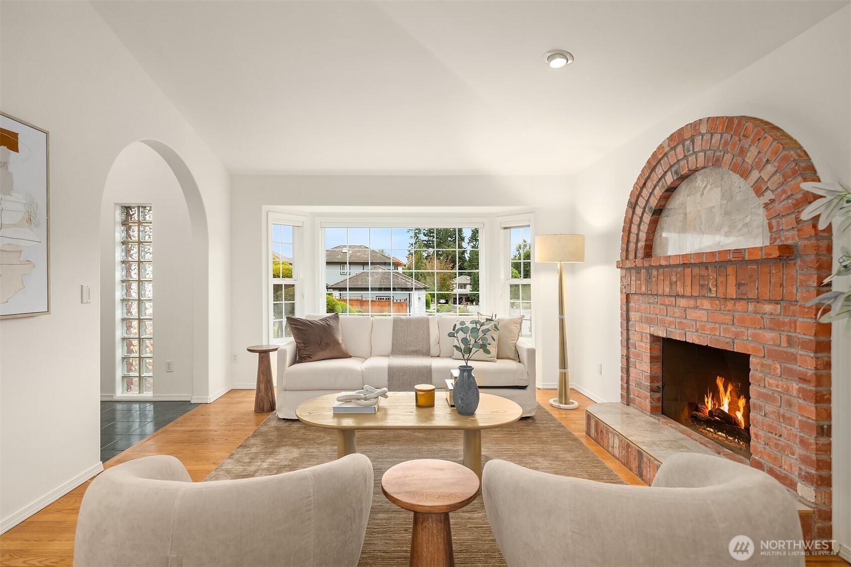 1417 232nd Place Southwest Bothell, WA 98021 - Photo 7 of 40 a living room with furniture a fireplace and a large window