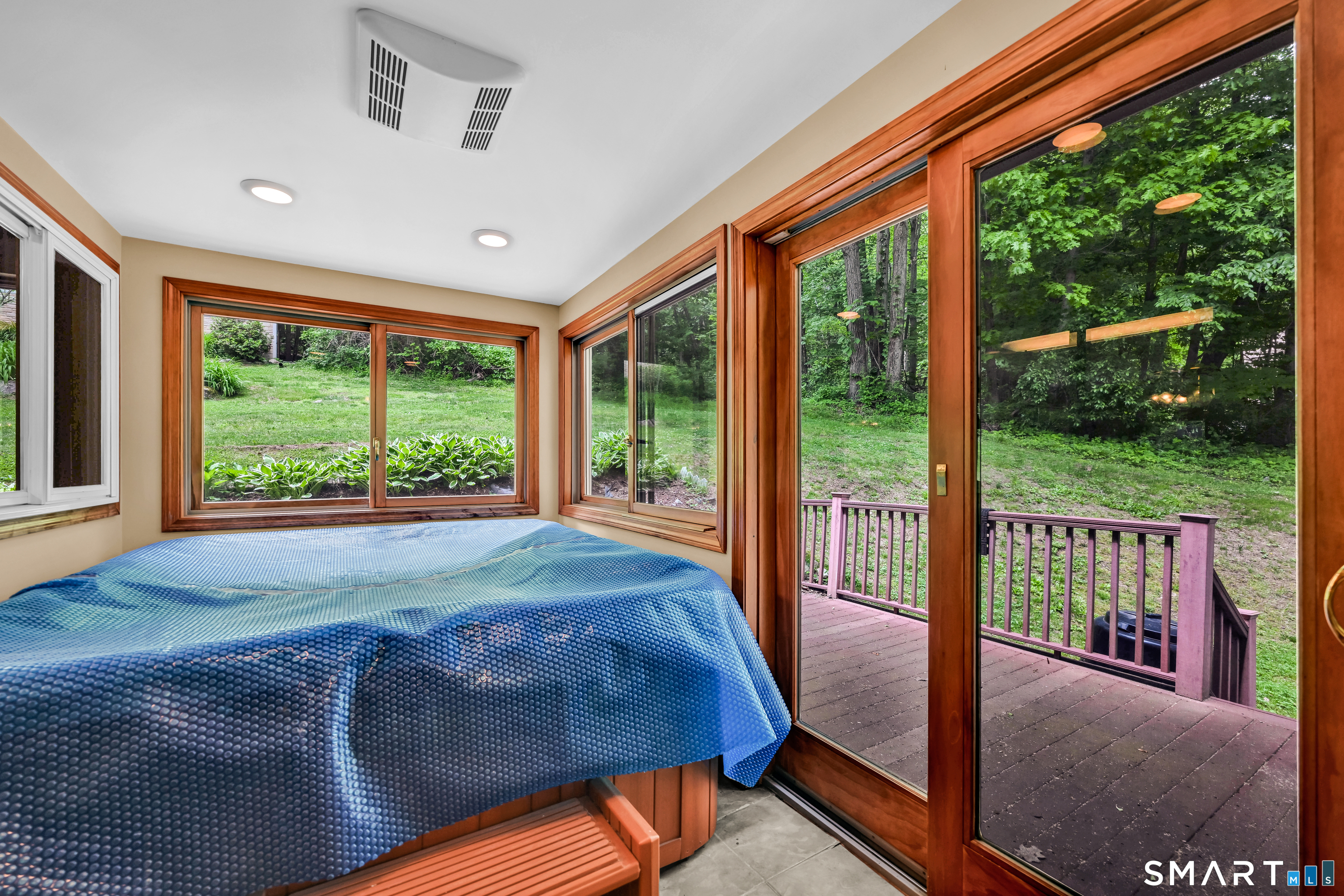 155 Lake Harwinton Road Harwinton, CT 06791 - Photo 33 of 39 a bed sitting in a bedroom next to a large window