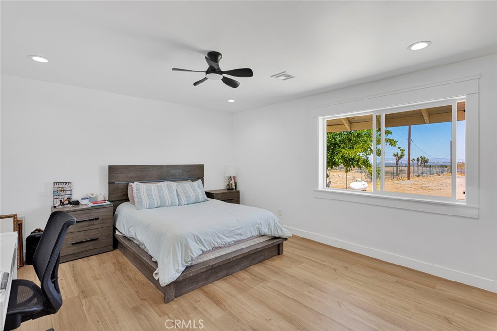 8038 Begonia Road Phelan, CA 92371 - Photo 28 of 49 a bedroom with a bed and a window