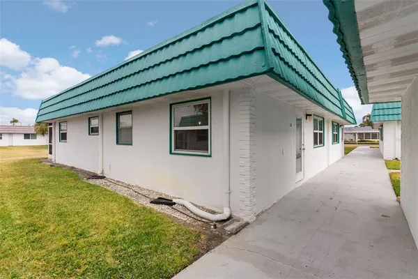 a backyard of a house with seating space