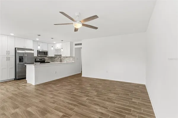 a view of kitchen with wooden floor