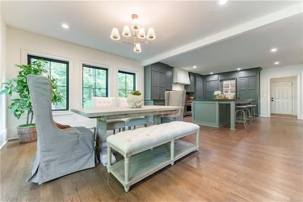 a room with stainless steel appliances kitchen island granite countertop furniture and a kitchen view