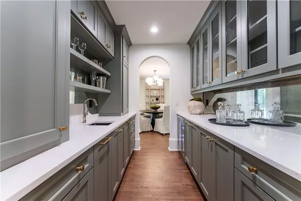 a kitchen with stainless steel appliances granite countertop lots of counter space a sink and cabinets
