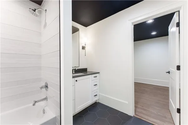 a bathroom with a tub and shower