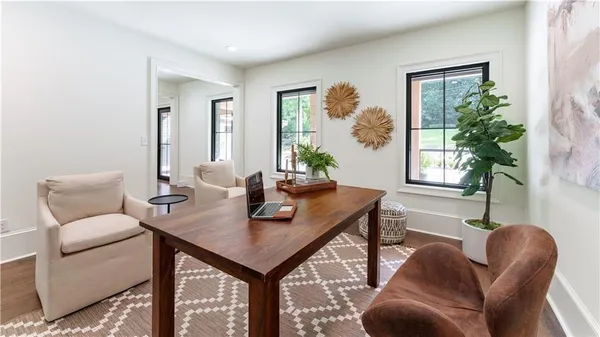 a view of a livingroom with furniture and window