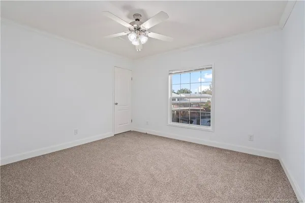 an empty room with wooden floor